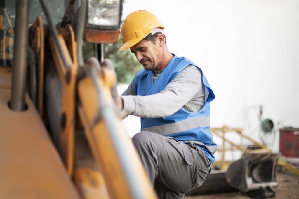 man using excavator digging day light